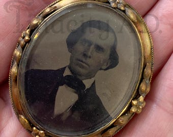 An Antique Victorian Memorial Double-Sided Brooch Featuring Tinted Portraits of an 1860's Man and Woman, Gold-Filled.