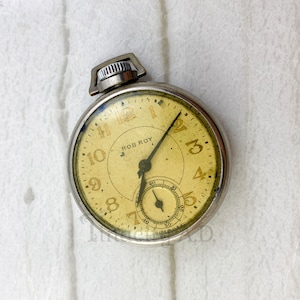 A Vintage Silver Tone Rob Roy Open Case Pocket Watch with Plastic Crystal, Circa 1930s