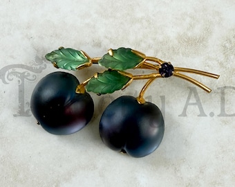 Vintage Austrian Iridescent Lucite Brooch, Purple Cherries, Green Leaves with Purple Rhinestone Accent in a Gold-Tone Mounting, Circa 1950's