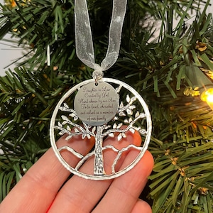 May include: Silver tree ornament with a message that reads "Daughter in Law Created by God Hand chosen by our Son To be loved, cherished and valued as a member of our family".