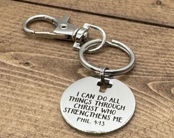 May include: Silver keychain with a round tag that reads "I can do all things through Christ who strengthens me Phil. 4:13".