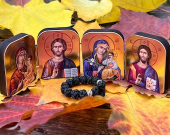 A set of two folding icons 2x1.6 in and a finger rosary. An icon of Jesus Christ and the Mother of God.