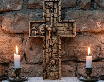 May include: A detailed wooden cross depicting Jesus Christ, set against a stone wall. Lit white candles in brass holders are positioned on either side, resting on a wooden shelf with a lace doily.