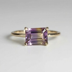 Minimalist emerald cut ametrine gemstone ring. Handmade purple and yellow stone ring, perfect for non-traditional engagement or anniversary jewelry.