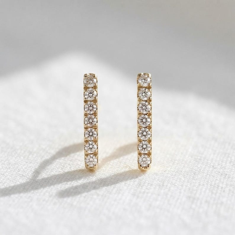 14k Solid Gold Diamond Bar Earrings: Modern Pave Studs, Fine Jewelry Gift for Her shown in an AI-generated listing photo