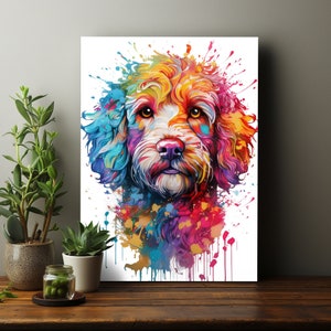 May include: A colourful abstract painting of a dog's face. The dog has a white face with a pink nose and brown eyes. The dog's fur is painted in shades of blue, green, yellow, orange, and red.