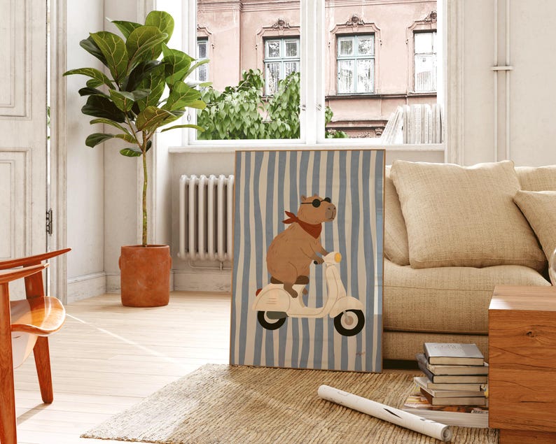 cool capybara on white scooter framed poster on wooden windowsill coastal boys bedroom decor blue stripe animal nursery print