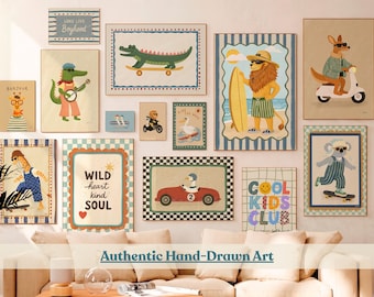 May include: A collection of framed art prints featuring whimsical animal illustrations. The artwork includes a giraffe, alligator, lion, kangaroo, and koala, each engaged in playful activities. The prints have a vintage aesthetic, with the text "LONG LIVE Boyhood", "WILD heart kind SOUL", and "COOL KIDS CLUB".