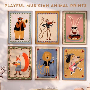 May include: Six framed art prints featuring whimsical animal musicians. A bear plays a trumpet, a monkey a violin, and a rabbit a keyboard. A fox plays a flute, a lion sings into a microphone, and a dog plays a guitar. The text at the top says "PLAYFUL MUSICIAN ANIMAL PRINTS."