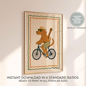 May include: A framed art print featuring a cartoon dog riding a bicycle, wearing sunglasses and a hat, with a guitar strapped to its back. The artwork has a beige background with a green and orange border. Text at the bottom reads: "INSTANT DOWNLOAD IN 6 STANDARD RATIOS READY TO PRINT IN ALL POPULAR SIZES."