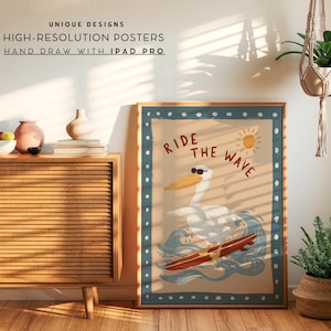 May include: A framed poster with a vintage-style illustration of a pelican surfing. The pelican wears sunglasses and rides a red surfboard on a blue wave. The poster has a blue border with white dots and the words "Ride the Wave".