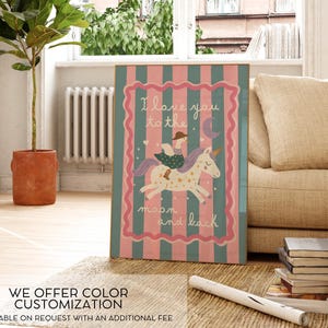 May include: A framed artwork with a whimsical design. The artwork features a unicorn with a rider, a crescent moon, and the text "I love you to the moon and back." The background has pink and teal stripes.