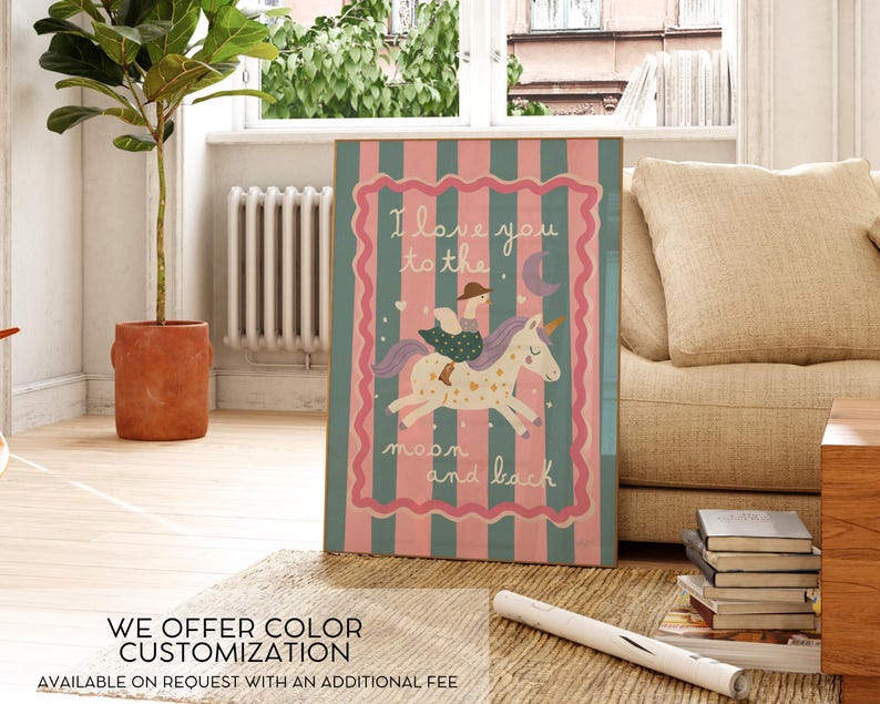 May include: A framed artwork with a whimsical design. The artwork features a unicorn with a rider, a crescent moon, and the text "I love you to the moon and back." The background has pink and teal stripes.