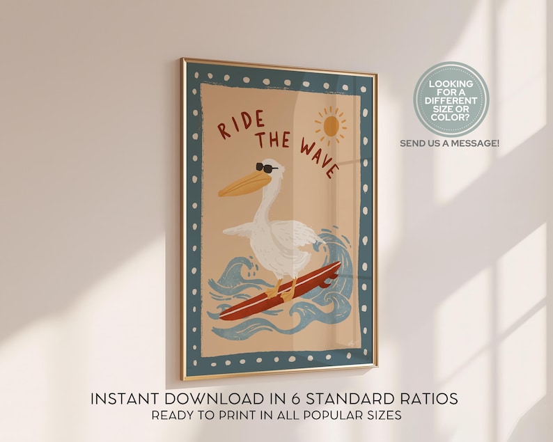 May include: A framed art print featuring a cartoon pelican wearing sunglasses and surfing on a red surfboard. The words "RIDE THE WAVE" are above the pelican. The print has a tan background with blue waves and a sun. The frame has a blue border.