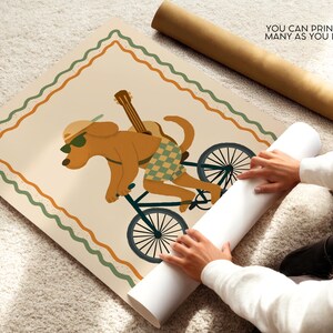 May include: A poster print featuring a cartoon dog riding a bicycle with a guitar on its back. The dog wears sunglasses and checkered shorts. The poster has a cream background with a green and orange border. Text on the poster reads: "YOU CAN PRINT AS MANY AS YOU LIKE."