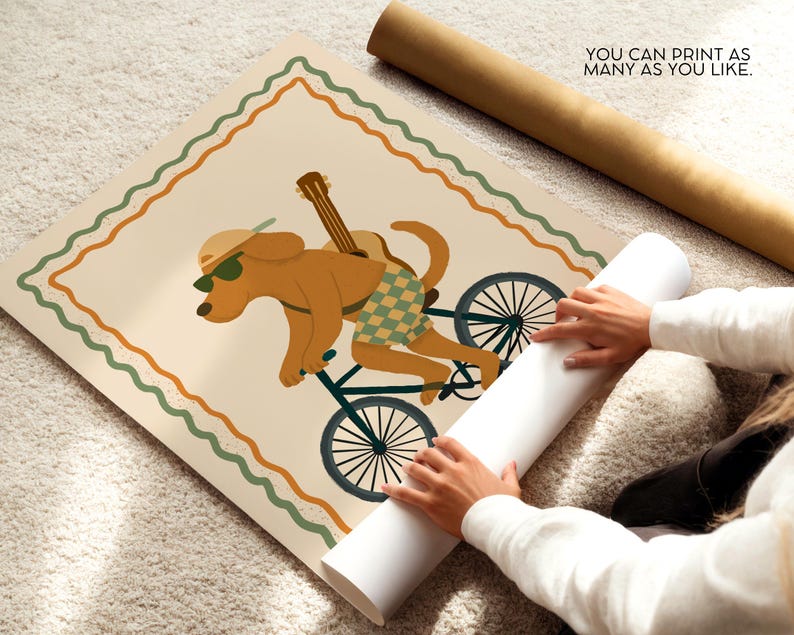 May include: A poster print featuring a cartoon dog riding a bicycle with a guitar on its back. The dog wears sunglasses and checkered shorts. The poster has a cream background with a green and orange border. Text on the poster reads: "YOU CAN PRINT AS MANY AS YOU LIKE."