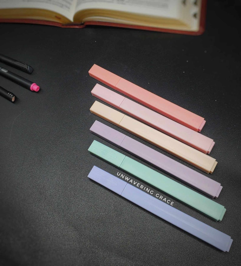 May include: Six pastel-colored highlighter pens with the words "UNWAVERING GRACE" printed on the bottom of the blue pen.