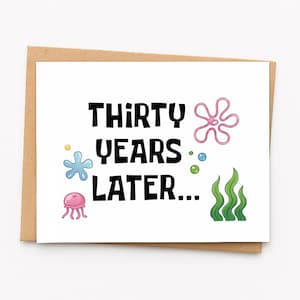 May include: A white greeting card with a brown envelope featuring the black text THIRTY YEARS LATER in a bold font. The design includes a pink jellyfish, a blue starfish, a pink flower-like shape, green seaweed, and small bubbles.
