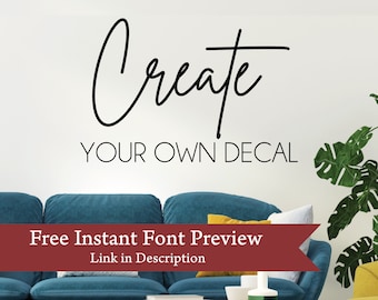 May include: A teal blue sofa with yellow throw pillows in a living room setting. The wall behind the sofa has a black and white decal that reads "Create your own decal". A free instant font preview link is displayed in red text.