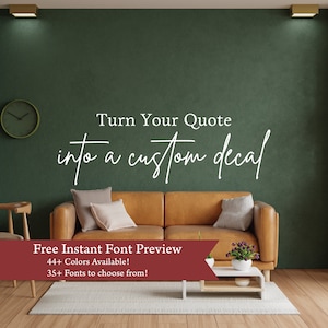 May include: A living room with a brown leather couch and a green wall. The wall has a white decal that says "Turn Your Quote into a custom decal". Below the decal is a red banner that says "Free Instant Font Preview 44+ Colors Available! 35+ Fonts to choose from!"