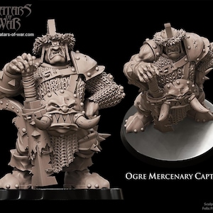 Puede incluir: Una figura miniatura de Ogre Mercenary Captain en color marrón claro con un casco texturizado de piel, armadura de cota de malla y una gran espada dentada. La figura muestra una expresión feroz con colmillos prominentes y lleva el sello Avatars of War.