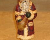 Paper mache Red Santa w Cape and Bag of Apples