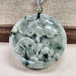 Well carved fish lotus carry out idiom 連年有餘 untreated natural type A jadeite jade pendant with pretty necklace cord