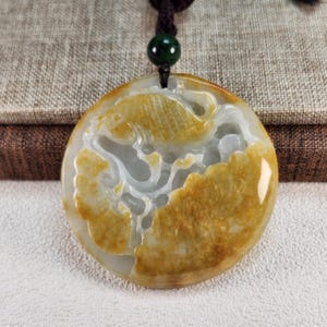 Well carved fish and lotus carry out 連年有餘 untreated natural type A jadeite jade pendant with pretty necklace cord