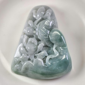 Fish with lotus pattern carry out chinese idiom 年年有餘 well crafted untreated natural type A jadeite jade pendant, adjustable necklace rope