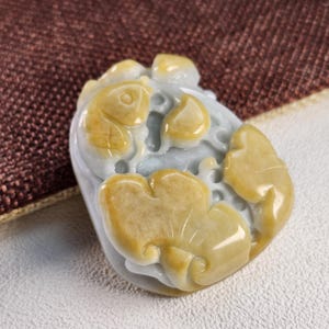 Well carved fish and lotus leaf flower untreated natural type A jadeite jade pendant, necklace cord, paperweight or ornament