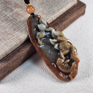 Grade A 3D lotus and fish 連年有餘 well carved on raw shape of jadeite untreated natural translucent jadeite jade pendant with necklace cord