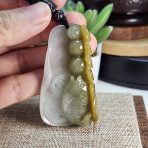 Two-sided 3D fish money coins ruyi and lotus leaf 連年有餘 well carved untreated natural translucent jadeite jade pendant with necklace cord