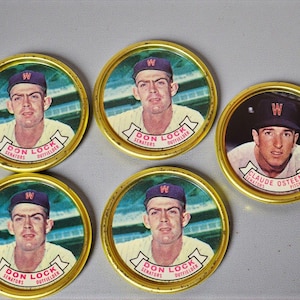 May include: A set of vintage baseball coasters with player portraits. Four coasters show Don Lock, Senators Outfielder, and one features Claude Osteen, Pitcher. Each coaster has a gold rim and a baseball cap.