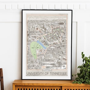 May include: A black framed print of a detailed map of the University of Tennessee campus in Knoxville, Tennessee. The map is in a vintage style and includes the text "UT" and "University of Tennessee".