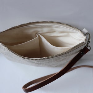Interior pockets of leather crossbody bag.