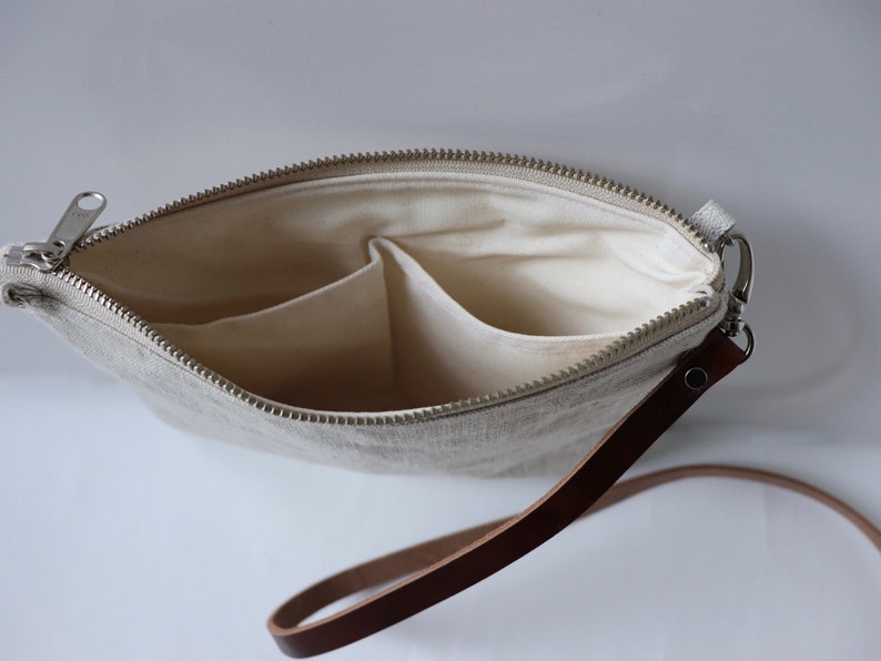 Interior pockets of leather crossbody bag.