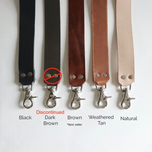 May include: Five leather straps with silver clasps in black, brown, brown, tan, and natural colors. The brown strap is labeled "Best seller". The dark brown strap is discontinued.