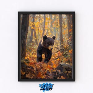 May include: A framed art print of a black bear cub in an autumn forest. The bear is walking through fallen leaves, with a backdrop of trees and golden foliage. The artwork has a painterly style and is signed "DTART GALLERY".