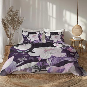 May include: A floral bedding set featuring a dark purple background with large white and pink peony flowers. The set includes a duvet cover and two pillowcases. The design has a watercolor effect, creating a soft, artistic look. The bedroom setting includes a round rug.