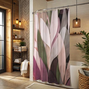 May include: A shower curtain featuring an abstract pattern of large, overlapping leaf-like shapes in shades of soft pink, muted olive green, deep burgundy, and charcoal gray, suspended from a metal rod with circular rings in a bathroom setting.