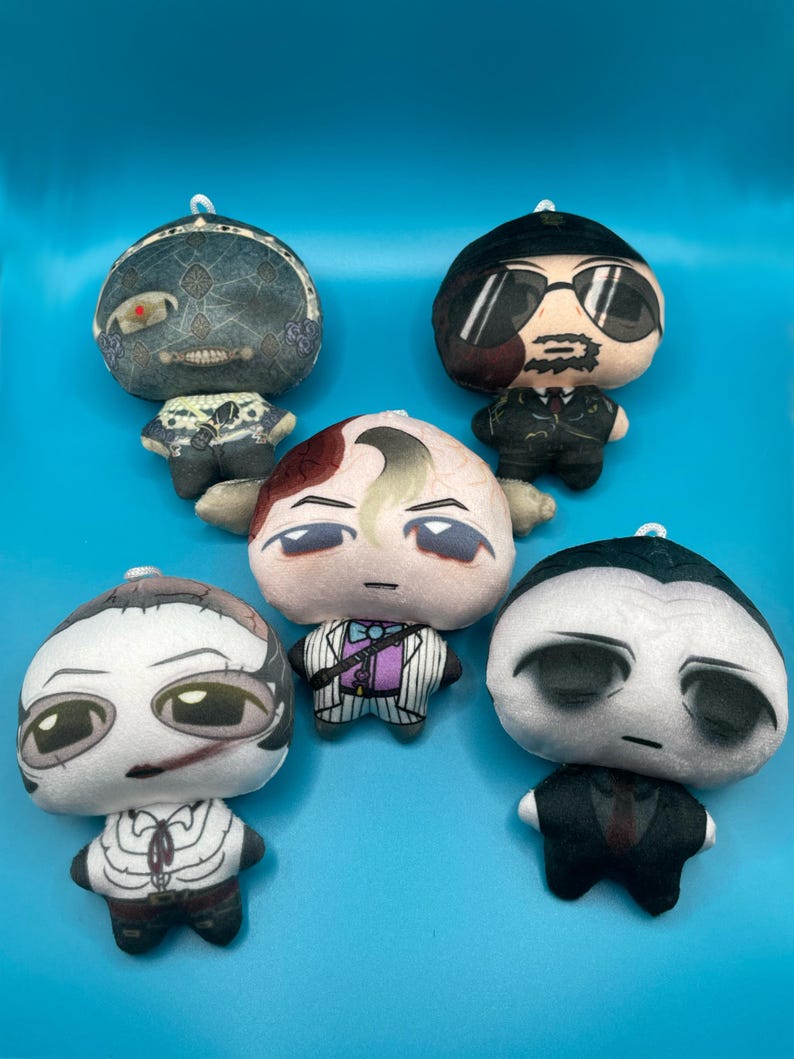 May include: Five plush dolls with unique character designs. Each doll features a round head and small body, with detailed facial expressions and outfits. The dolls are in various colors, including black, white, and shades of gray, set against a blue background.