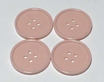 4 large pale coral / flesh 1 1/2" buttons, plastic buttons, 4-hole buttons, craft buttons, sewing buttons, crocheting buttons,  buttons