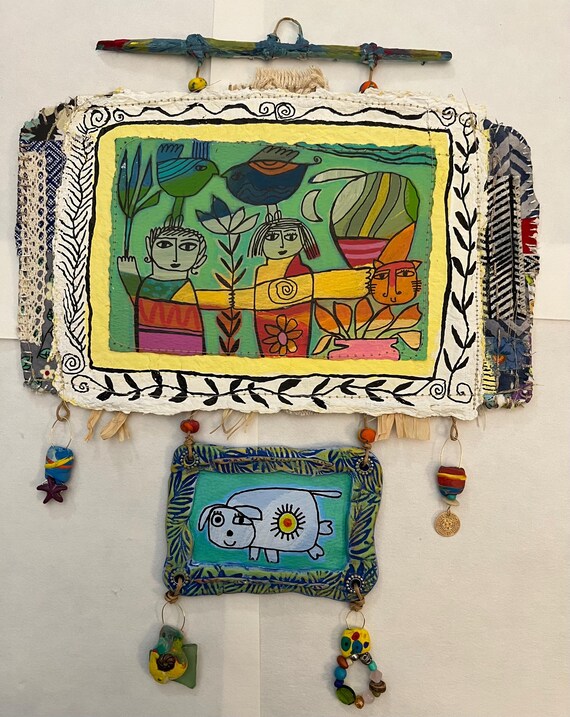 The Happy Dance - folkart on watercolor paper with handmade paper and polymer clay pieces.