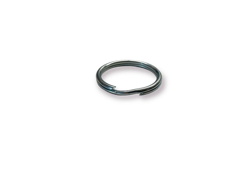 May include: A silver key ring with a split ring opening.
