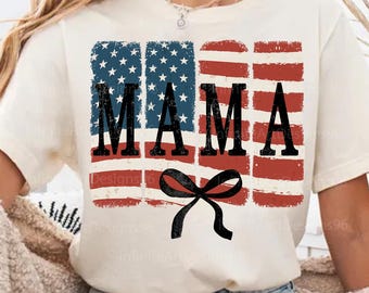 May include: A white t-shirt with a distressed American flag design and the word "MAMA" in black lettering. A black bow is centered below the text.