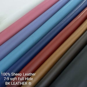 May include: A collection of folded sheep leather hides in various colours including white, pink, light blue, dark blue, red, tan, brown, and black. The text on the image reads 100% Sheep Leather, 7-9 sqft Full Hide, and BK LEATHER.