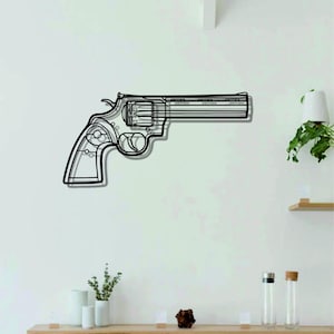 Może przedstawiać: Czarno-biały rysunek rewolweru na białej ścianie. Broń jest zamontowana na ścianie i skierowana w prawo.