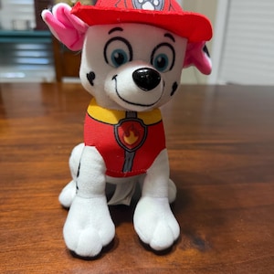 May include: A white ceramic mug with a black handle and the text "But First, Coffee" in a black, handwritten-style font. The mug is likely 11-15 ounces in size, perfect for a morning beverage.