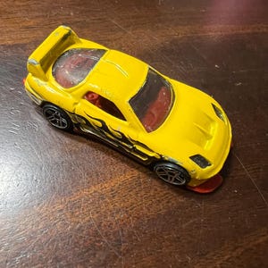 Mazda RX-7 24/Seven gialla Hot Wheels del 2002
