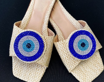 Sandalias de mal de ojo